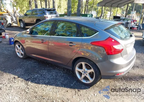 2012 Ford Focus Titanium z USA, uszkodzony, nr VIN 1FAHP3N22CL213454